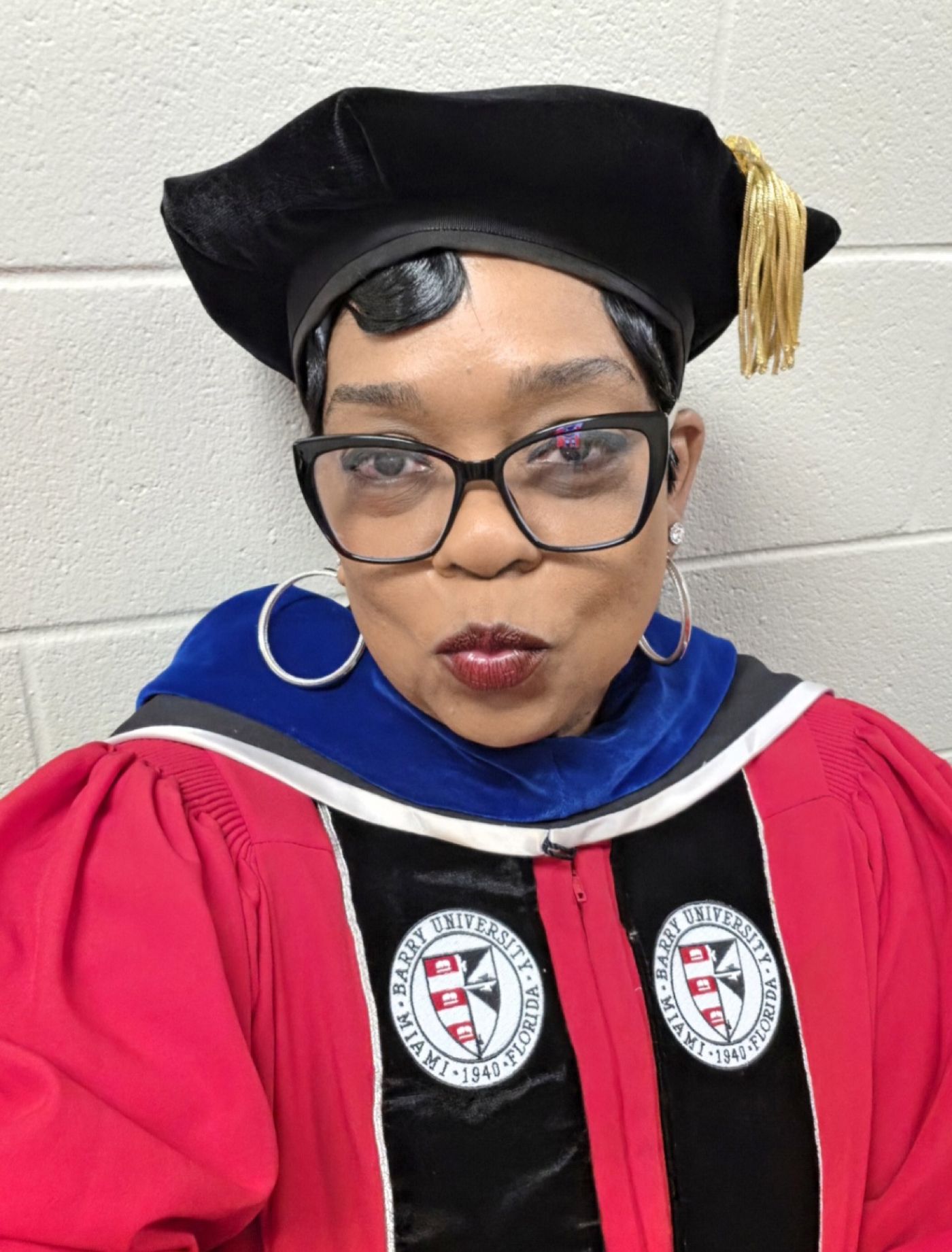 Dr. Sheila in doctoral regalia